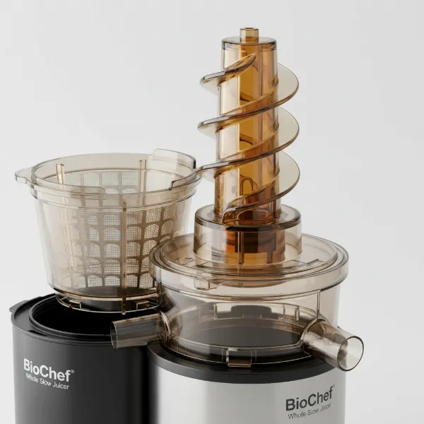 Close-up of BioChef Atlas Whole Slow Juicer components, including auger, strainers, and motor base, highlighting BPA-free materials.